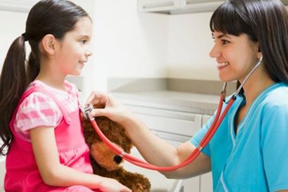 Doctor examining young girl — Pediatric and Adolescent Healthcare in Shelburne, VT