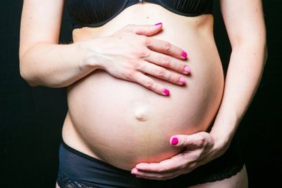Pregnant Belly with Hands of mother — Pediatric and Adolescent Healthcare in Shelburne, VT