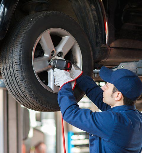 Mechanic Replacing Tire | Aiken, SC | Morris Tire & Auto