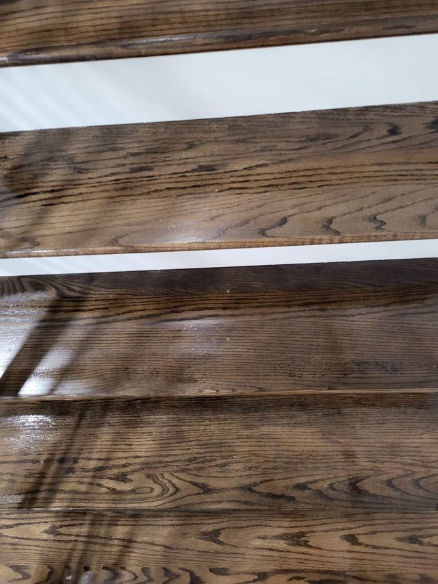 Close-up of two weathered wooden planks with visible grain and a gap between them