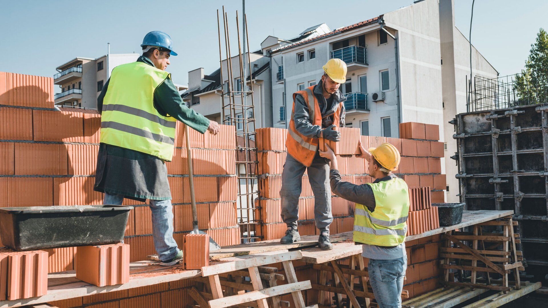 Men Working On Brick Wall — Portsmouth, VA — Smiley's Masonry Inc.