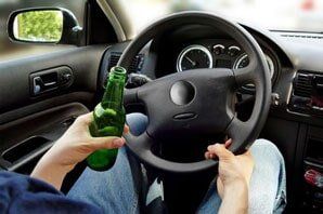 Man Holding A Bottle While Driving — Criminal in Suite C, Delco, NC