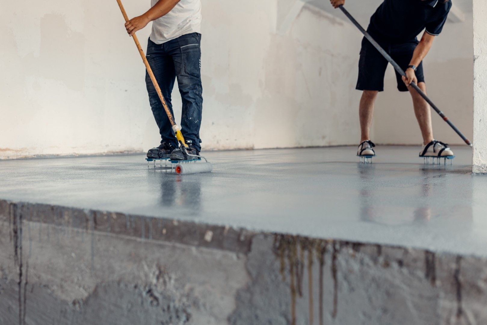 Two Men Installing Garage Epoxy Floor