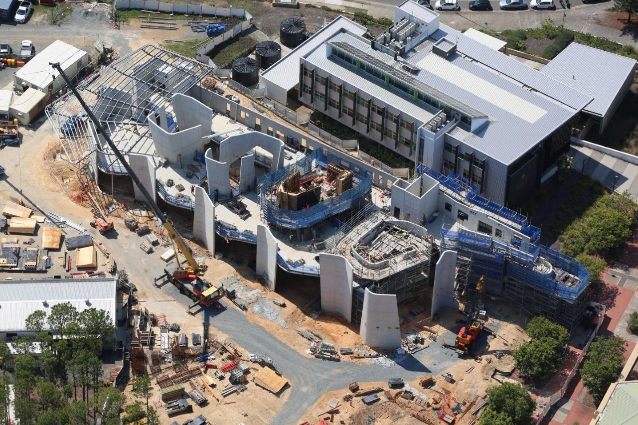 An aerial view of a large building under construction