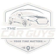Logo for The Car Guys showing a car in a gray shield with the slogan “Your time matters. We come to you.”