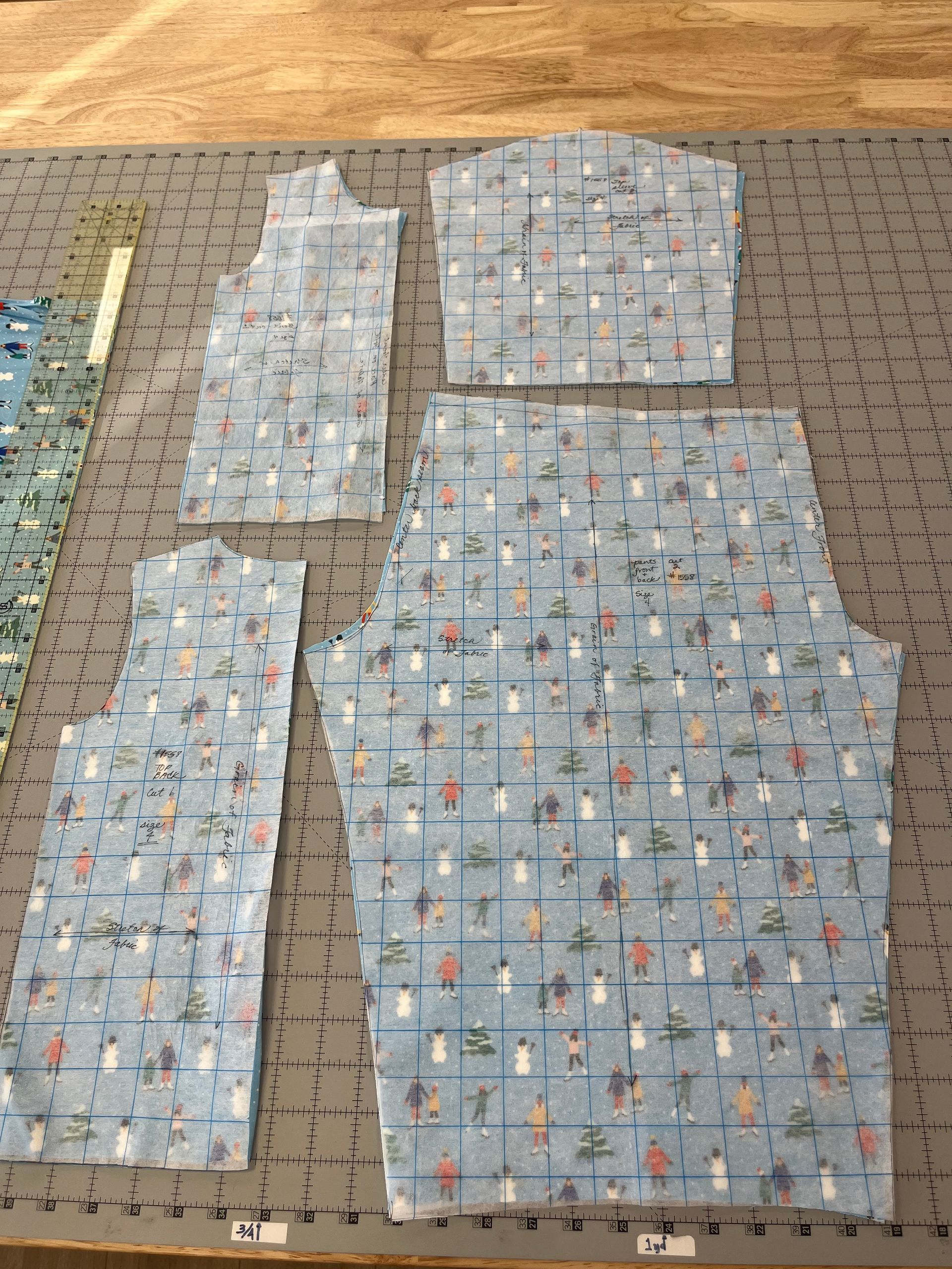 A piece of fabric is sitting on top of a cutting board.