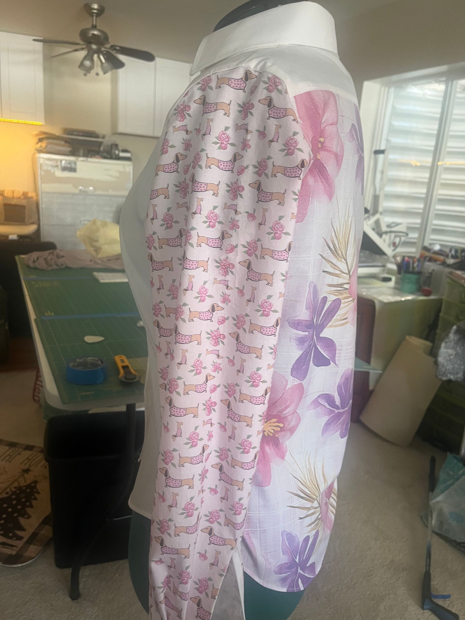 A mannequin is wearing a white shirt