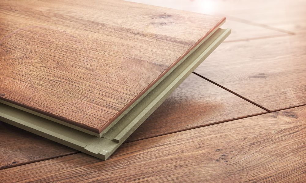 Two Pieces of Wood Are Stacked on Top of Each Other on a Wooden Floor — Mareeba Floor Coverings Centre in Tablelands, QLD