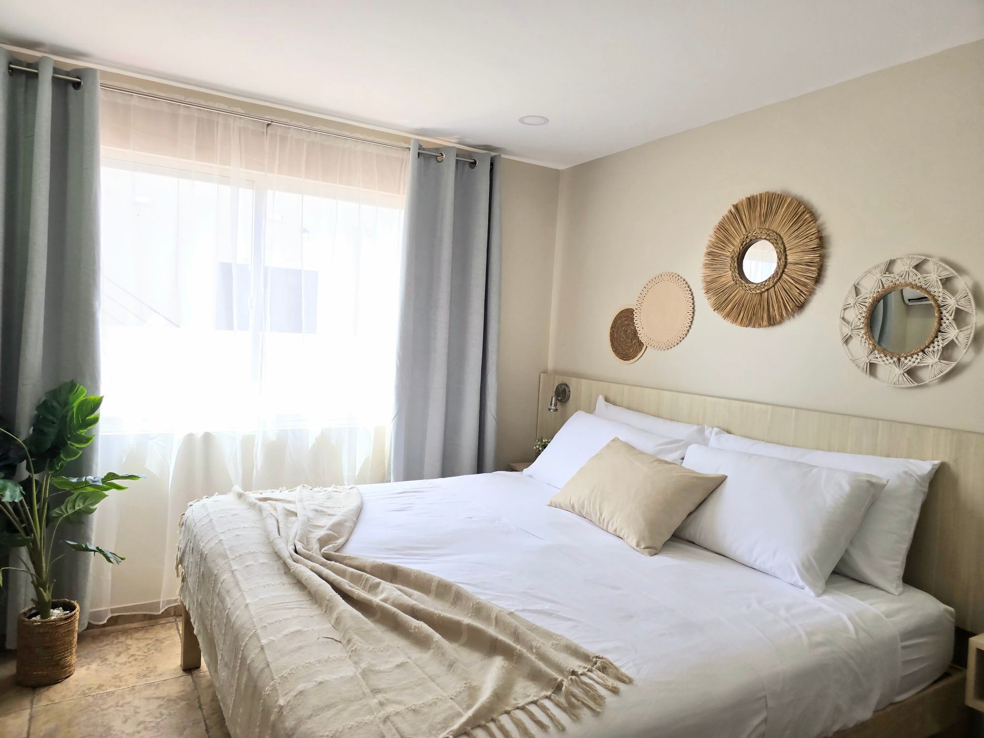 A living room with a couch , table and refrigerator