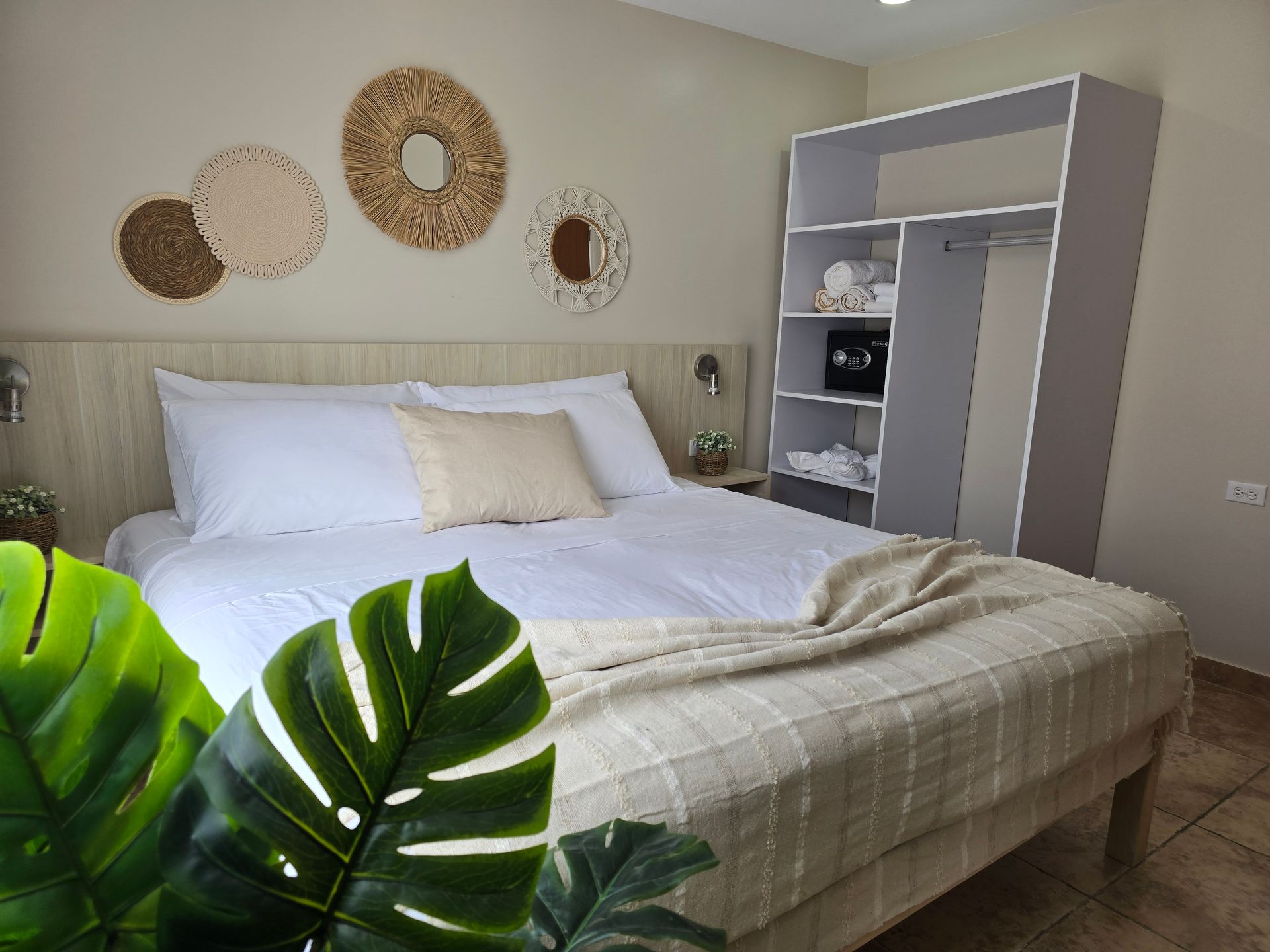 A patio with a chair and a table in front of a house