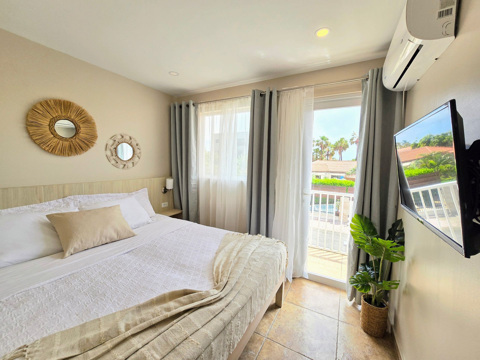 A bathroom with a sink and a closet filled with towels.