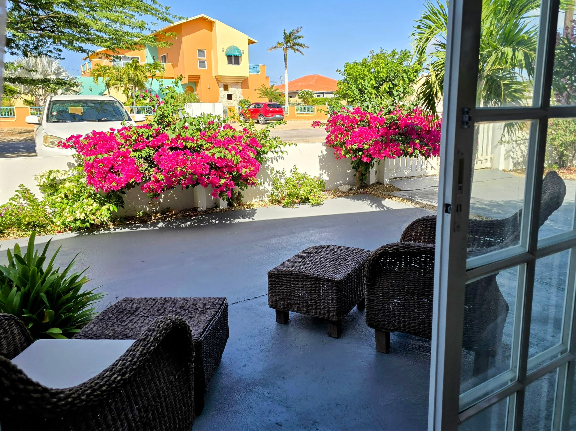 A living room with a table , chairs , and a couch.