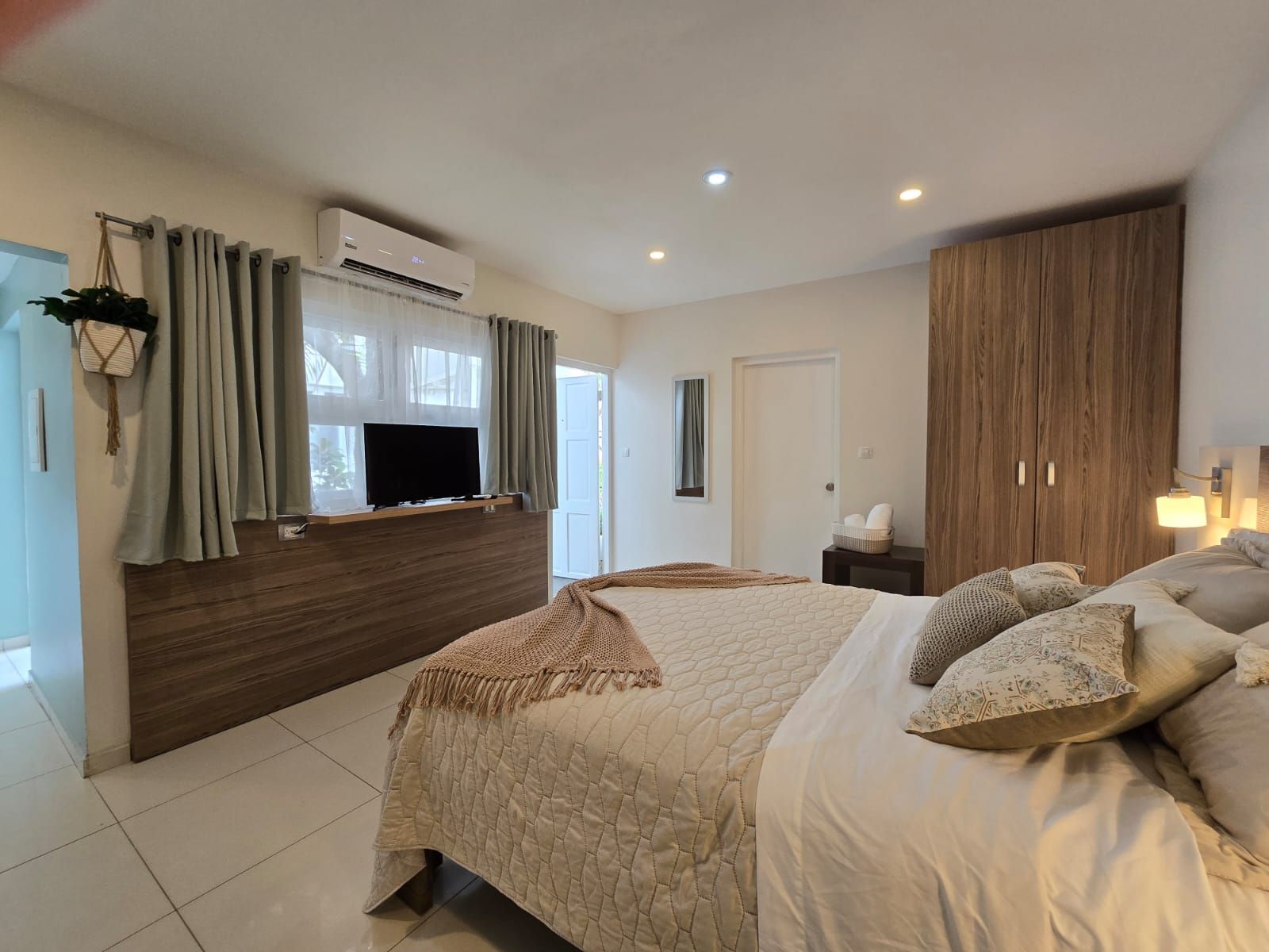 A desk with a computer on it and a lamp on it.