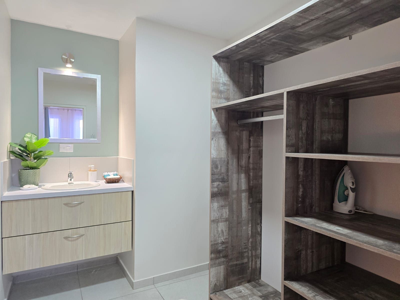 There is a picture of a tree on the wall above the table.