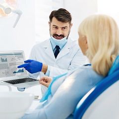 Dentist — Skilled Dentist Consulting the Patient in Merrillville, IN
