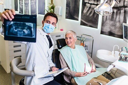 Family Dentist — Dentist Showing Results To Patient in Merrillville, IN