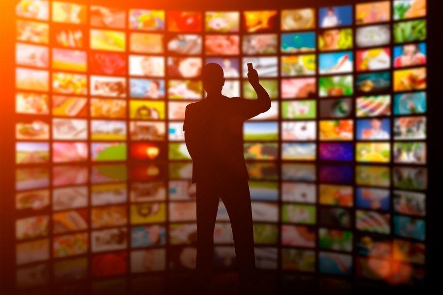 several television screens presenting movie metadata