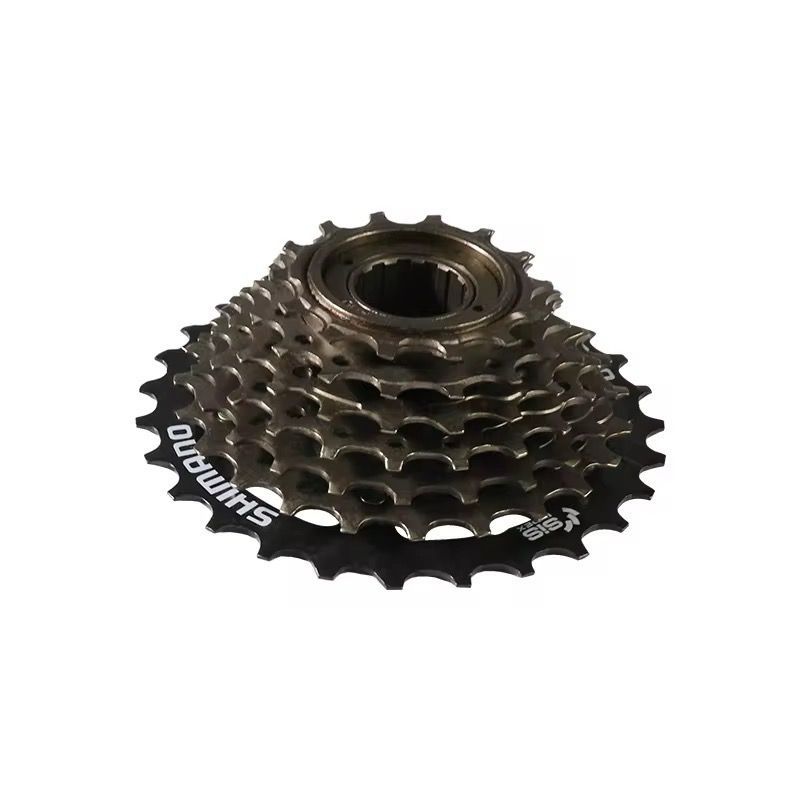 Shimano 7-speed fietsfreewheel met gouden tandwielen en zwarte accenten, van bovenaf gezien.