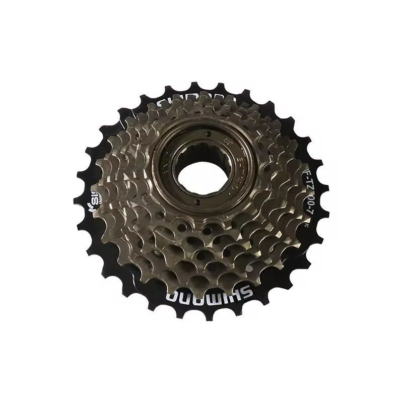 Shimano 7-speed fietsfreewheel met gouden tandwielen en zwarte accenten, van bovenaf gezien.