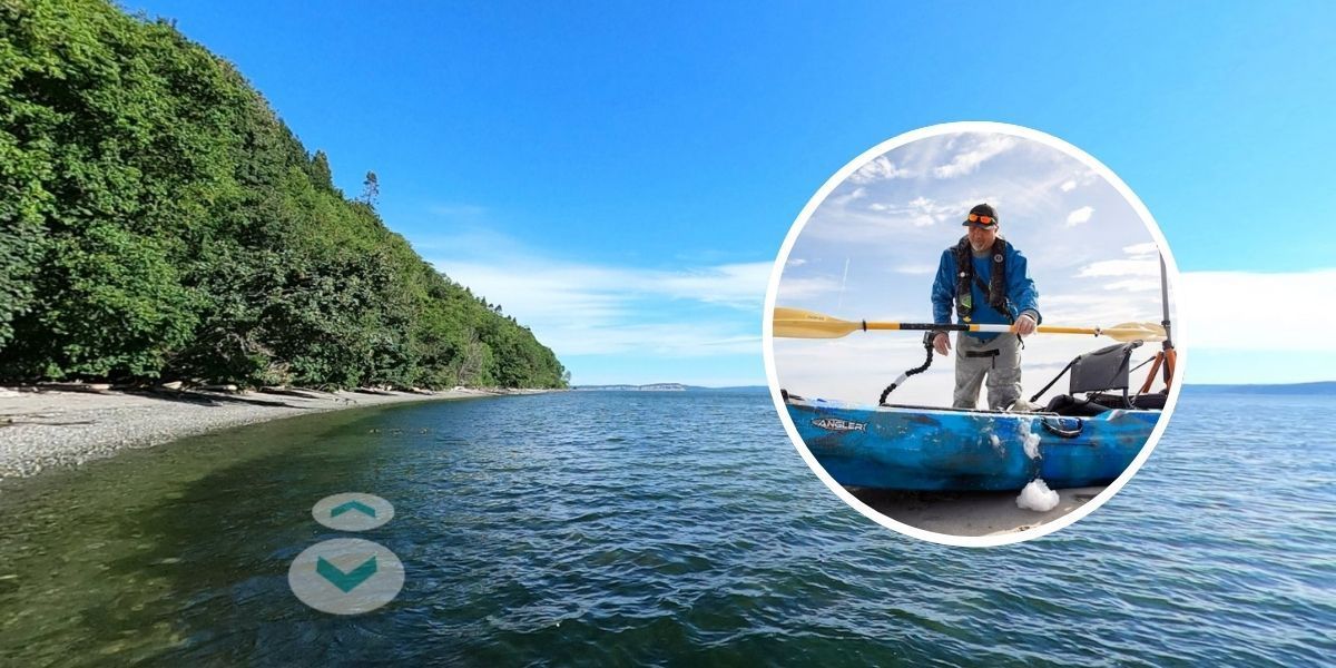 Brian Footen standing behind his kayak