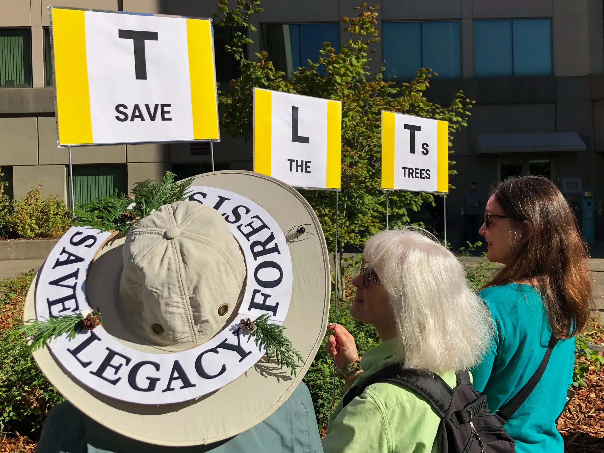 TLT-Save the Trees signs held by KEC members.