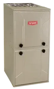 A bryant air conditioner is sitting on a white surface.