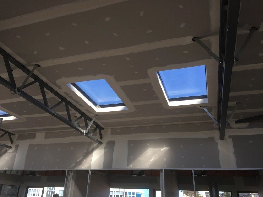 A ceiling with a few skylights on it