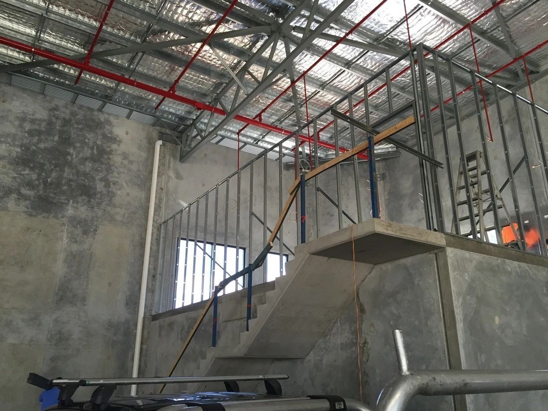 A staircase is being built in a building under construction