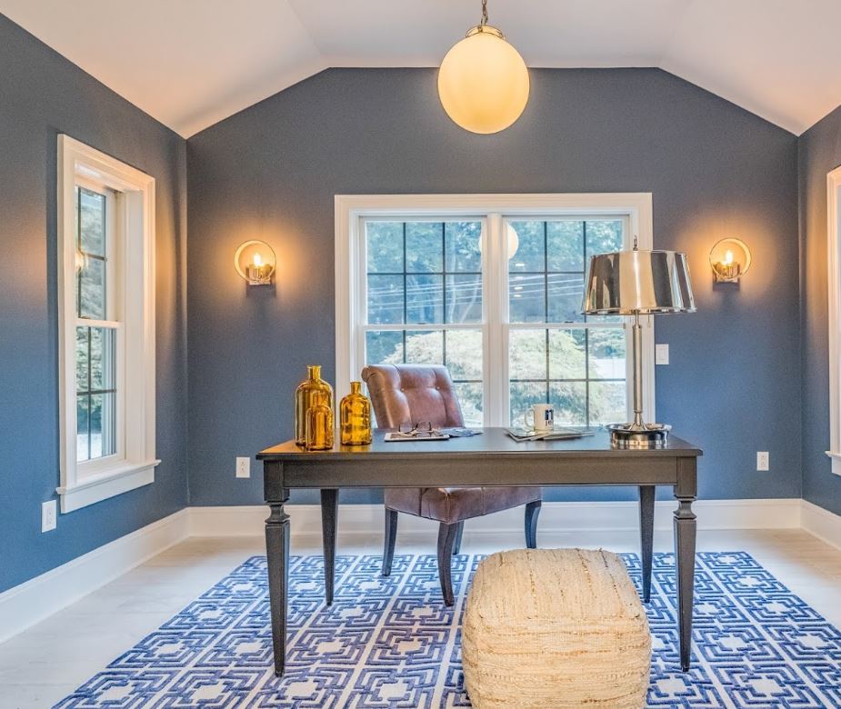 round pendant and wall sconces in office room at home