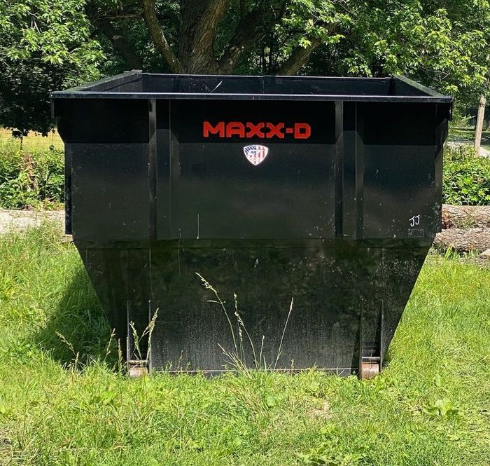 A MAXX-D dumpster in a customers yard in Nixa, Mo.