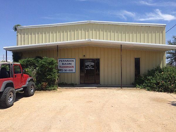 Yellow storefront with a “PENNINGTON GAS” sign, red vehicle at left, and dirt lot under a blue sky