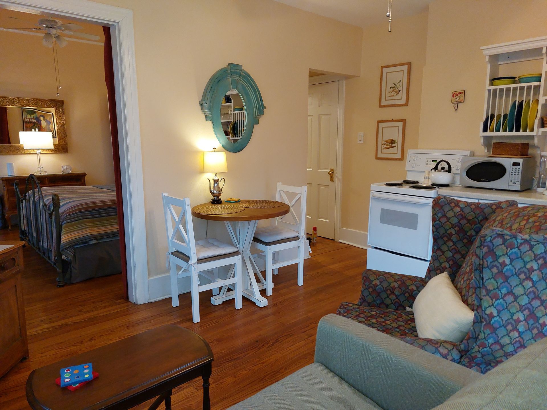 A living room with a table and chairs and a couch