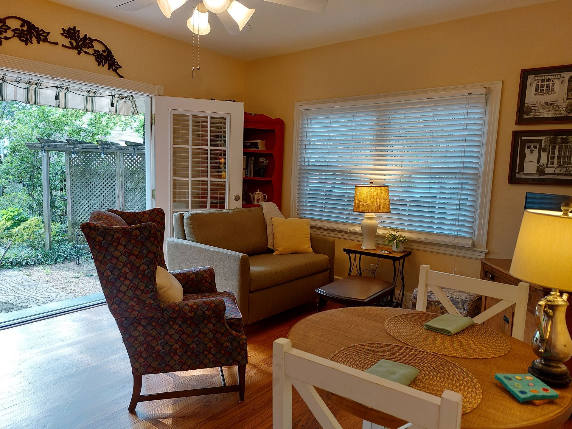 A living room with a couch and chairs and a table