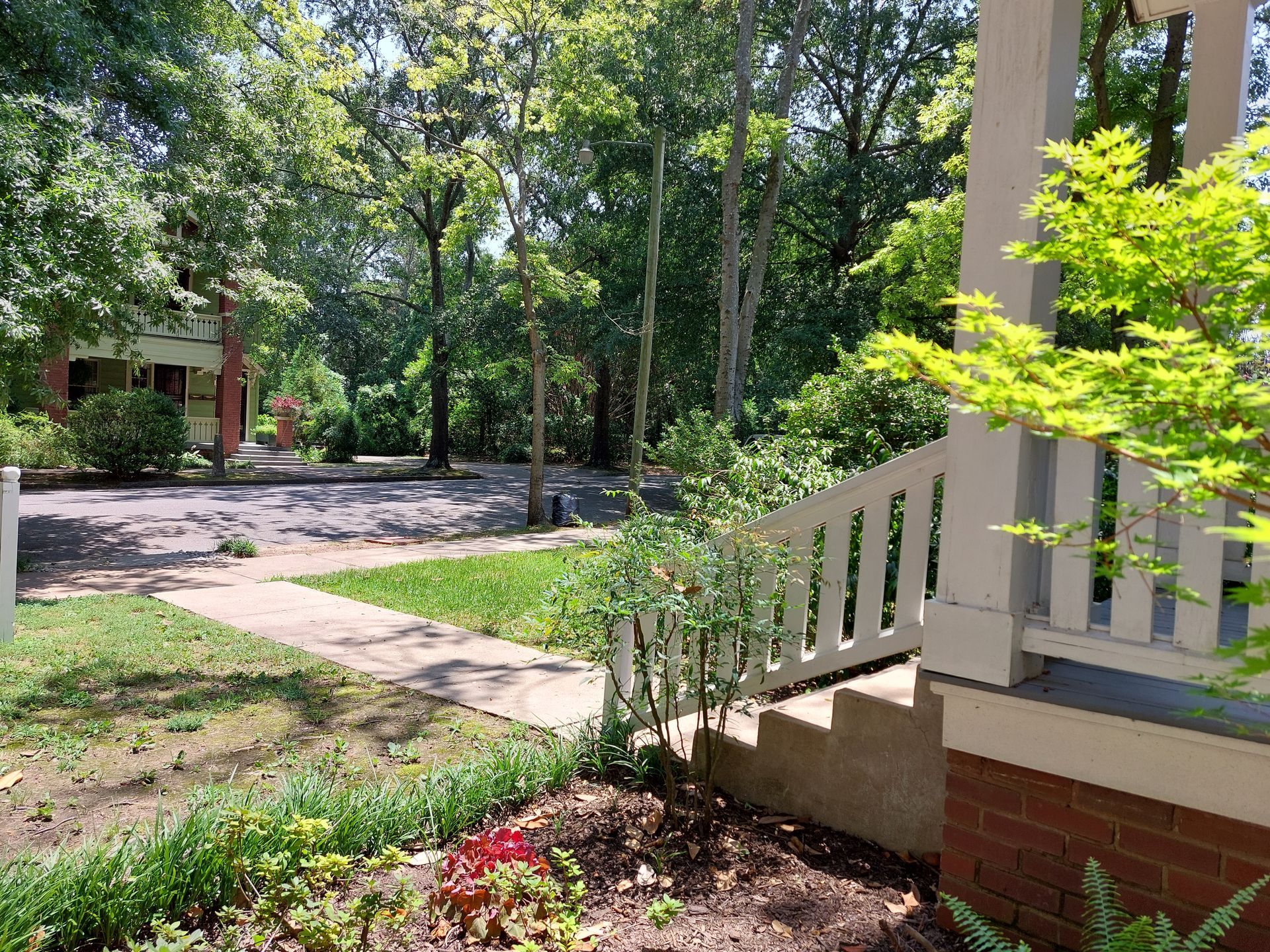 A house with a porch and stairs leading up to it