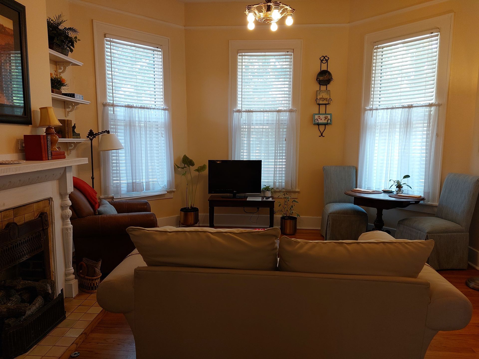 A living room with a fireplace and a couch