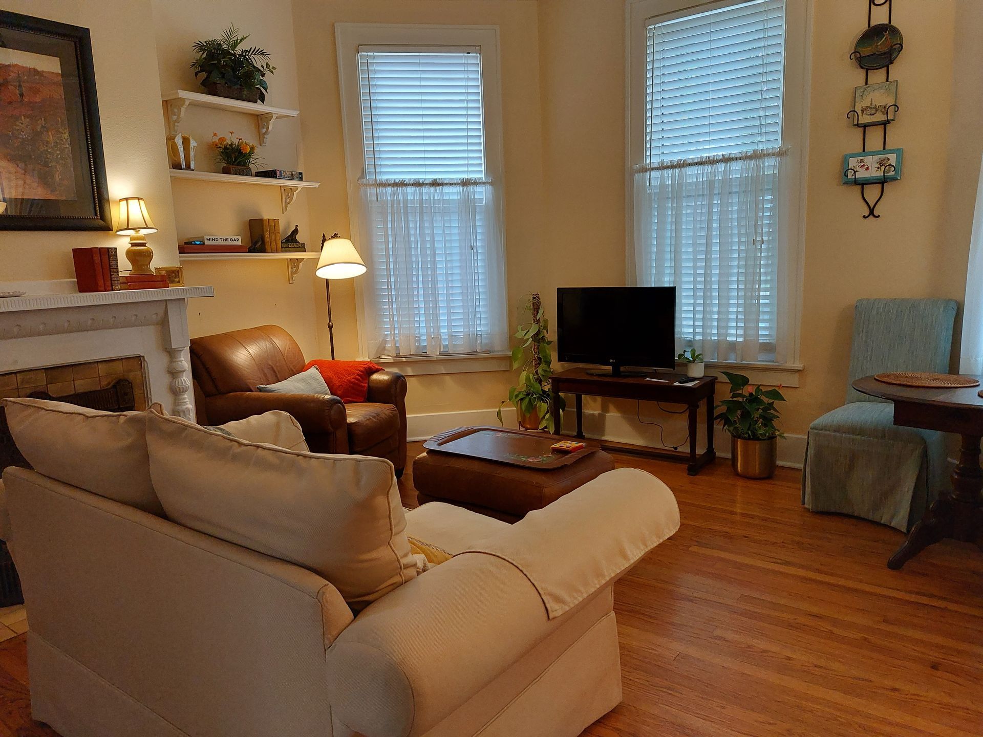 A living room with a couch a chair and a television