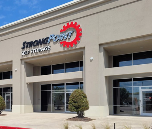 The outside of a building that says strong point self storage