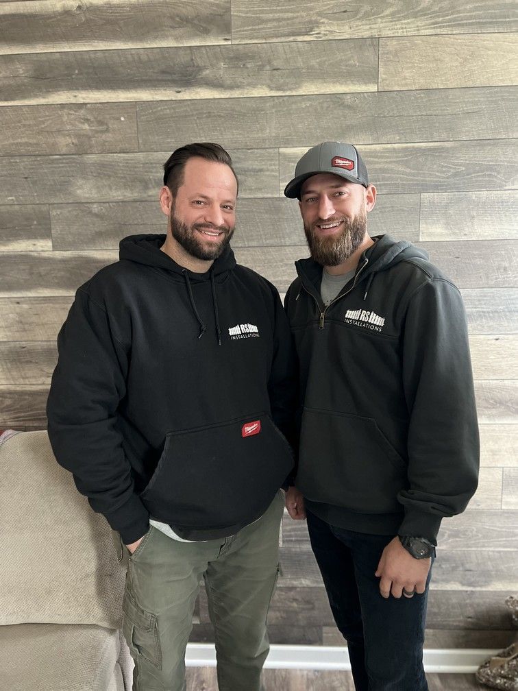 RS Installations founders standing next to each other.