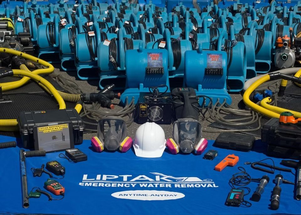 Water flooding staircase and landing, two buckets collecting water. Dark wood stairs, white and beige walls. Water flooding staircase and landing, two buckets collecting water. Dark wood stairs, white and beige walls.