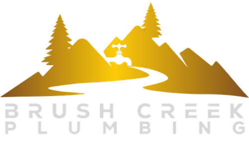 Logo for Brush Creek Plumbing: Golden mountains, trees, and faucet over a flowing water graphic. Gray text below.