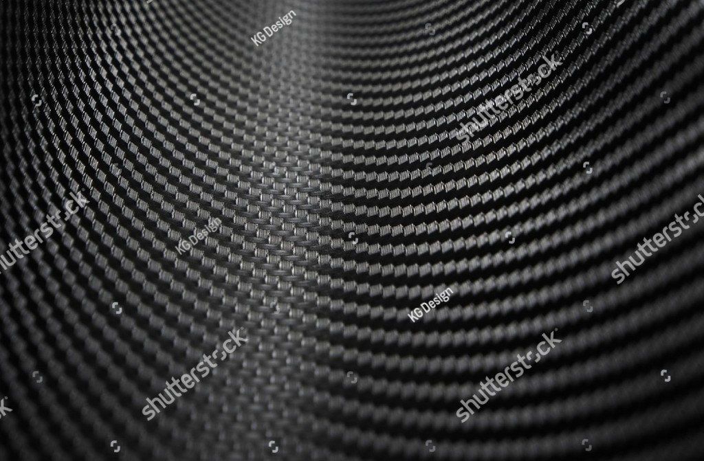 Ein Schwarzweißfoto eines kreisförmigen Musters auf einer Metalloberfläche.