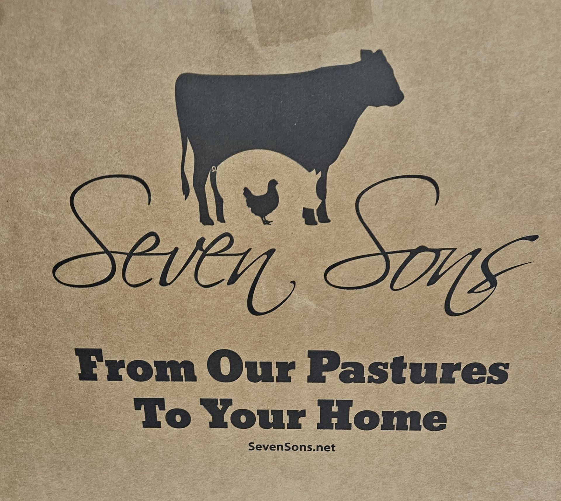 A plate of bread and a bunch of cups of food on a table.