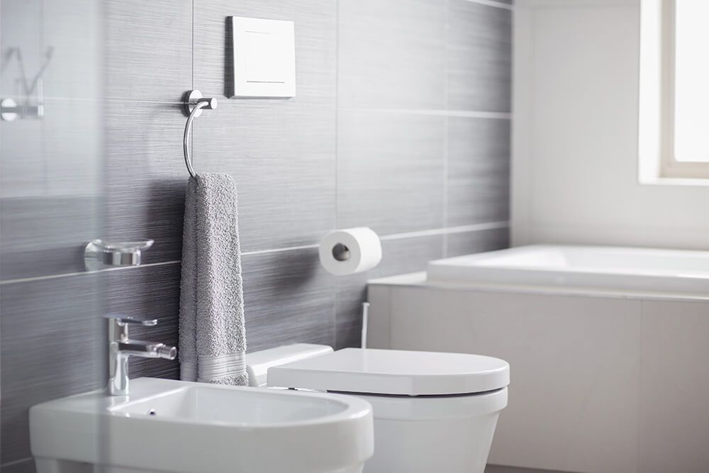 A Bathroom with A Toilet , Bidet and Bathtub — Canberra Kitchen & Bathroom in Fyshwick, ACT