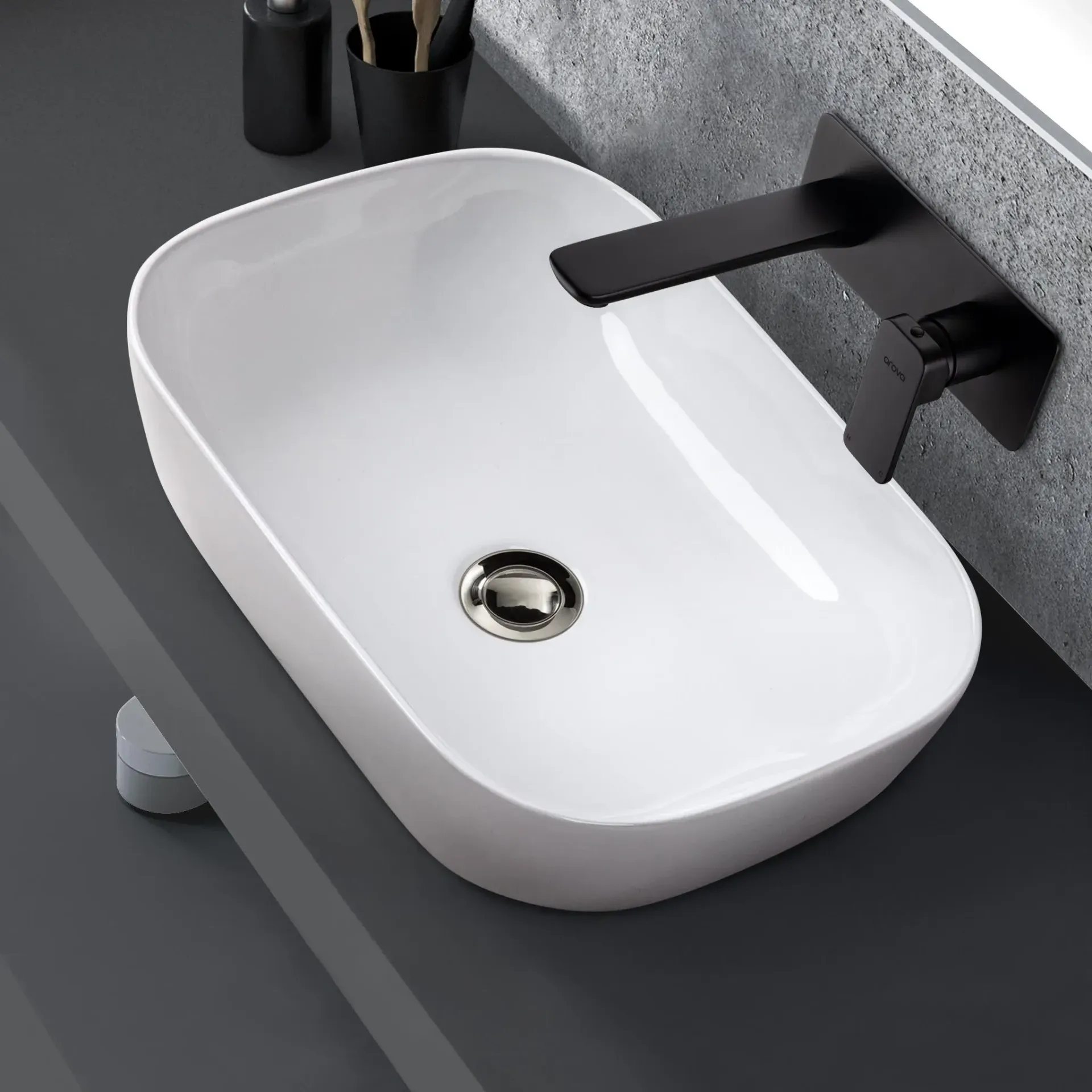 A White Bathroom Sink with A Black Faucet — Canberra Kitchen & Bathroom in Fyshwick, ACT