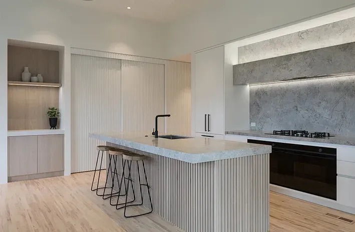 A Kitchen with A Large Island and Stools — Canberra Kitchen & Bathroom in Fyshwick, ACT