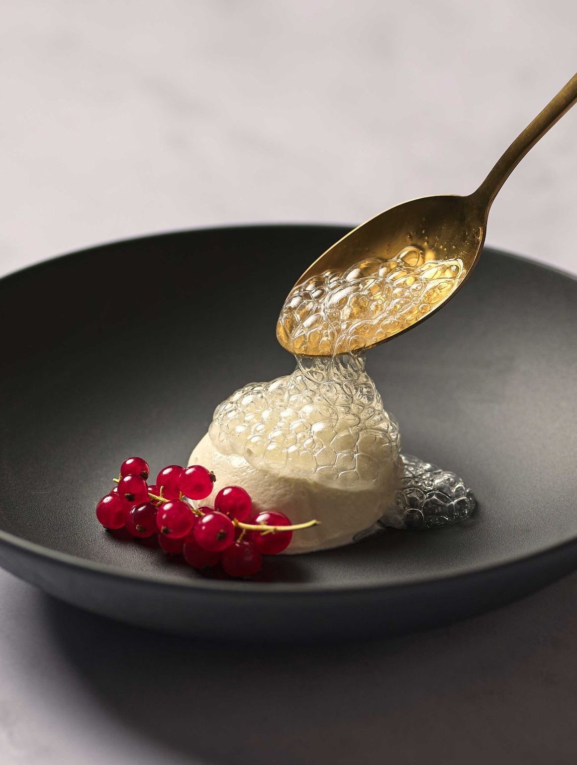 A plate of food with whipped cream and berries on it