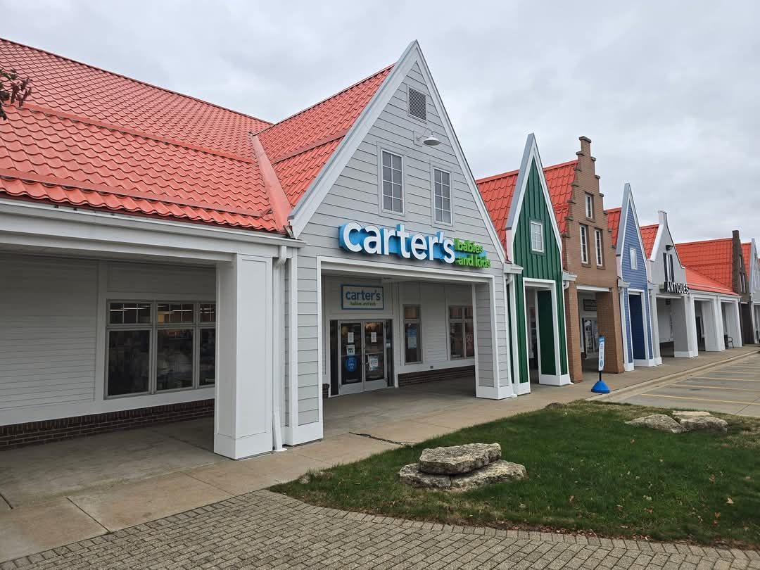 Carter's store in a row of colorful, Dutch-style buildings with red tiled roofs.