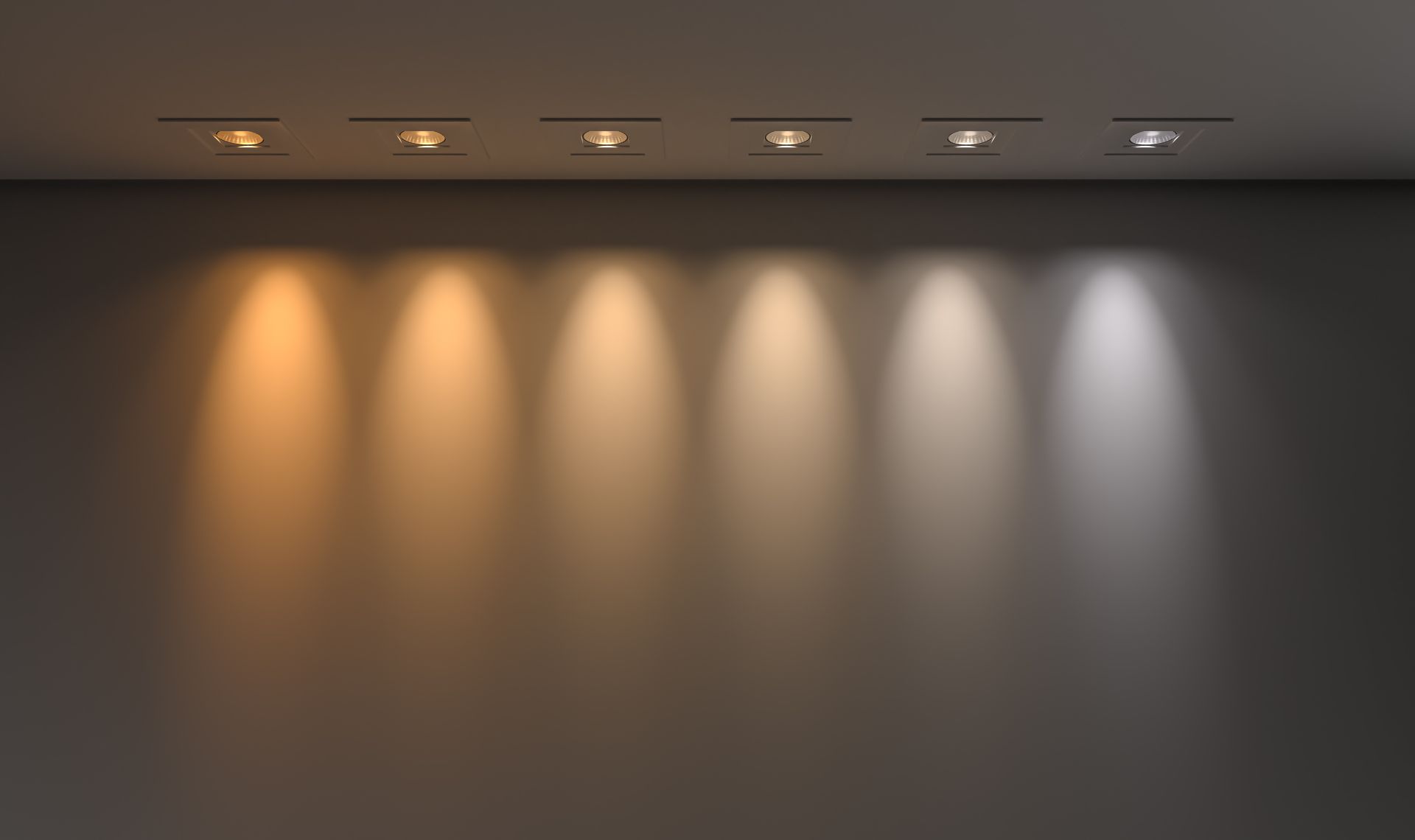 Seven spotlights illuminate a wall with varying color temperatures, from warm orange to cool white.