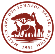 A circular logo for the Martin and Osa Johnson Safari Museum featuring an elephant, two giraffes, and a tree in red.