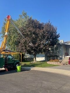 Tree Service Truck Parked In Front Of A House - Benton City, WA - Aria Tree Service